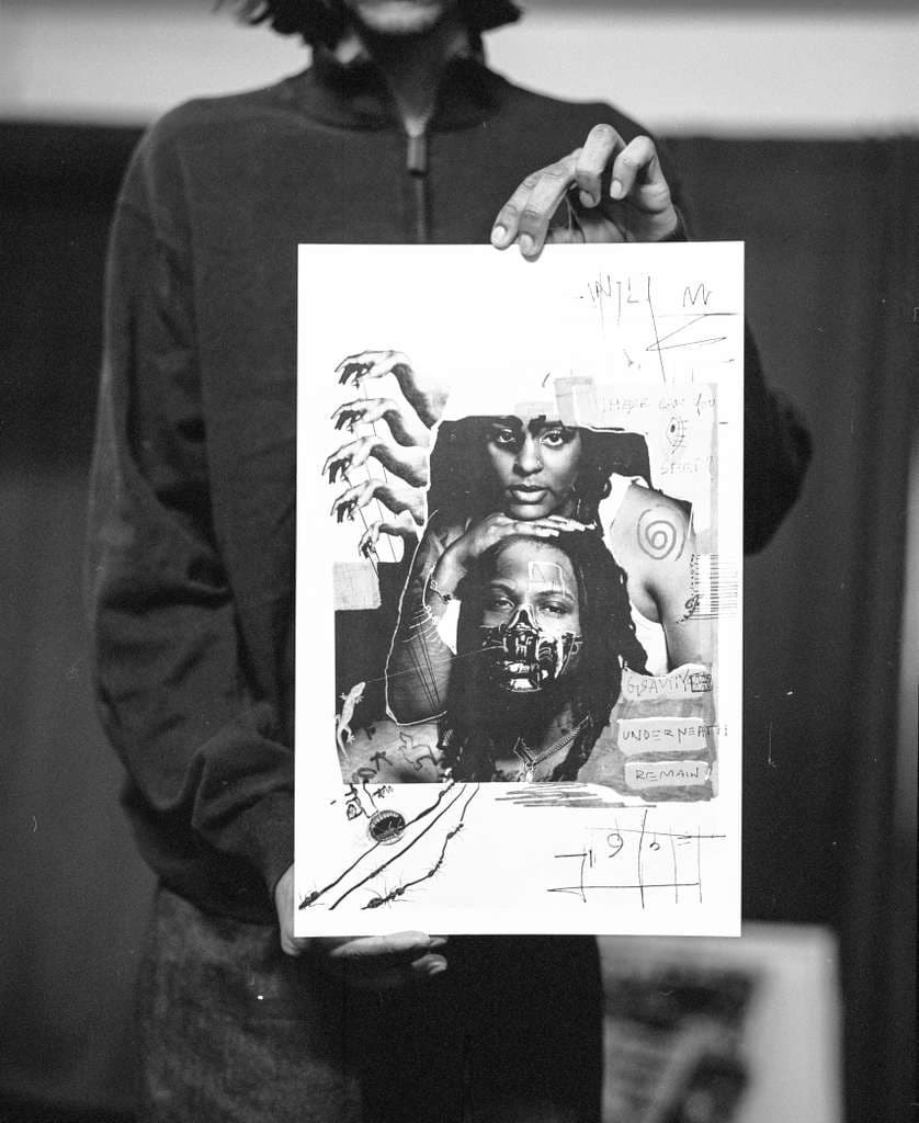 Holding up a printed collage
